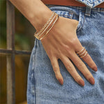 BRACELETE EM ELOS LISOS E ZIRCÔNIAS BANHADO A OURO