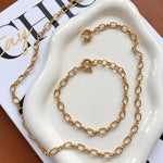 PULSEIRA EM ELOS OVAIS INTERCALADOS E TRANÇADOS COM FECHO BOIA
